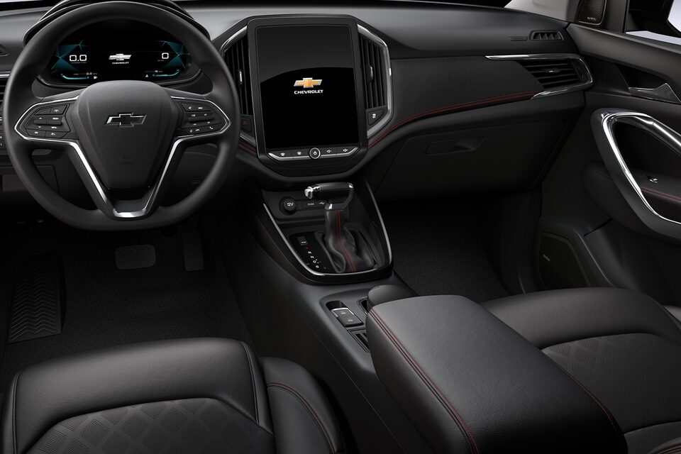 Black leatherette interior with red stitching and perforated inserts