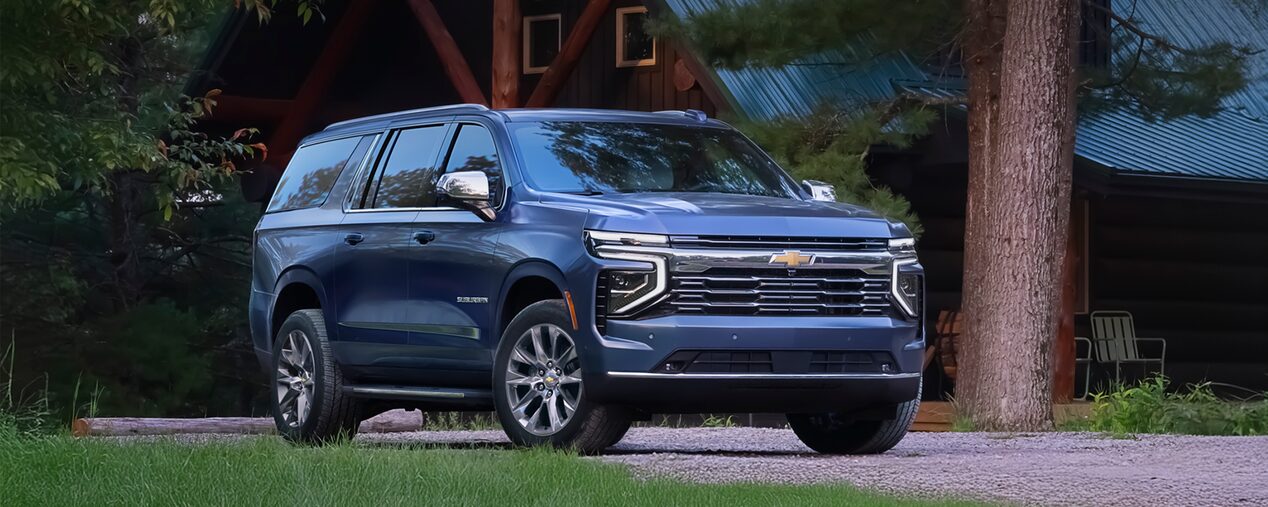 Front Side View of the 2025 Chevrolet Suburban SUV on gravel