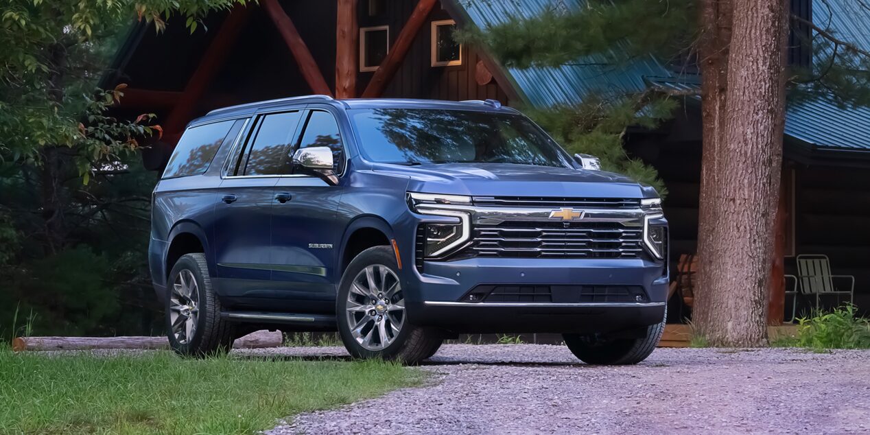 Front Side View of the 2025 Chevrolet Suburban SUV on gravel