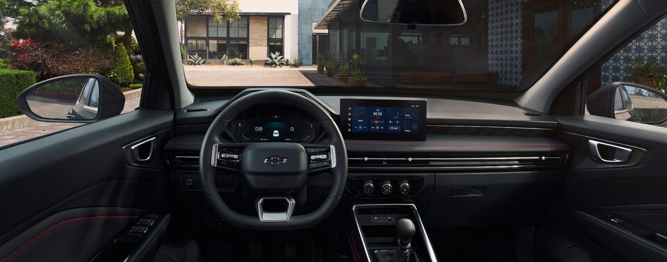 Driver’s Seat View of the Steering Wheel and Display Monitor of 2026 Chevrolet Groove
