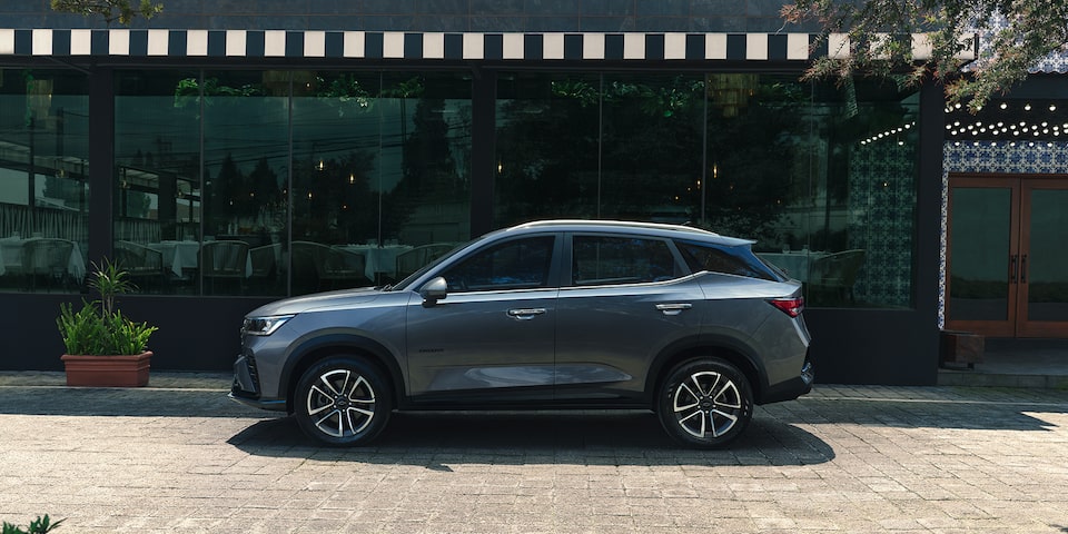 Side view of a Tungsten Grey 2026 Chevrolet Groove parked in a city