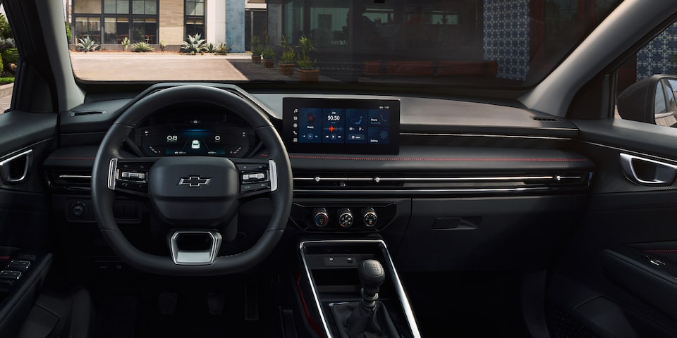 Driver's Seat View of the Steering Wheel and Display Monitor of 2026 Chevrolet Groove