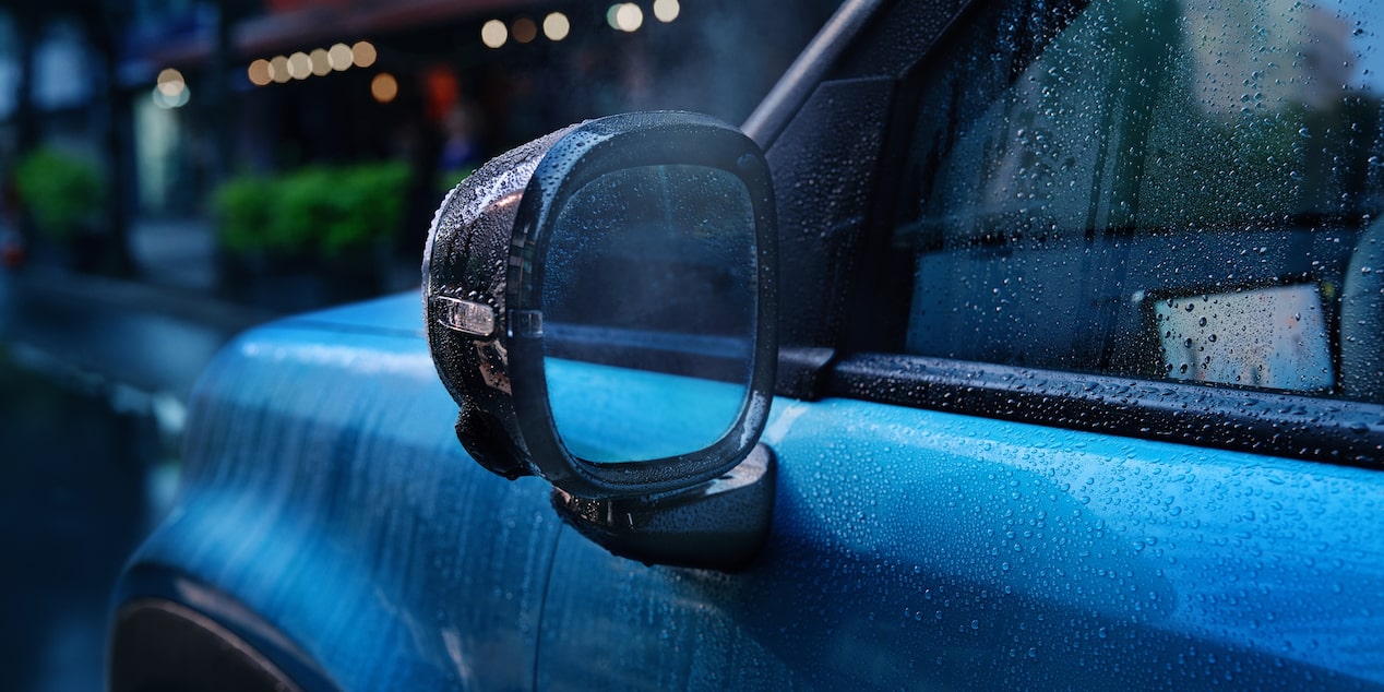 Driver side mirror of the Chevrolet Spark  EUV in  Sea Blue with Polar White Roof