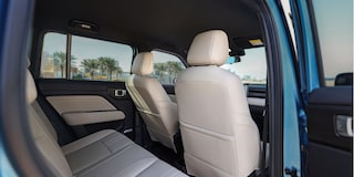 Rear interior of the Chevrolet Spark EUV with beige leatherette.