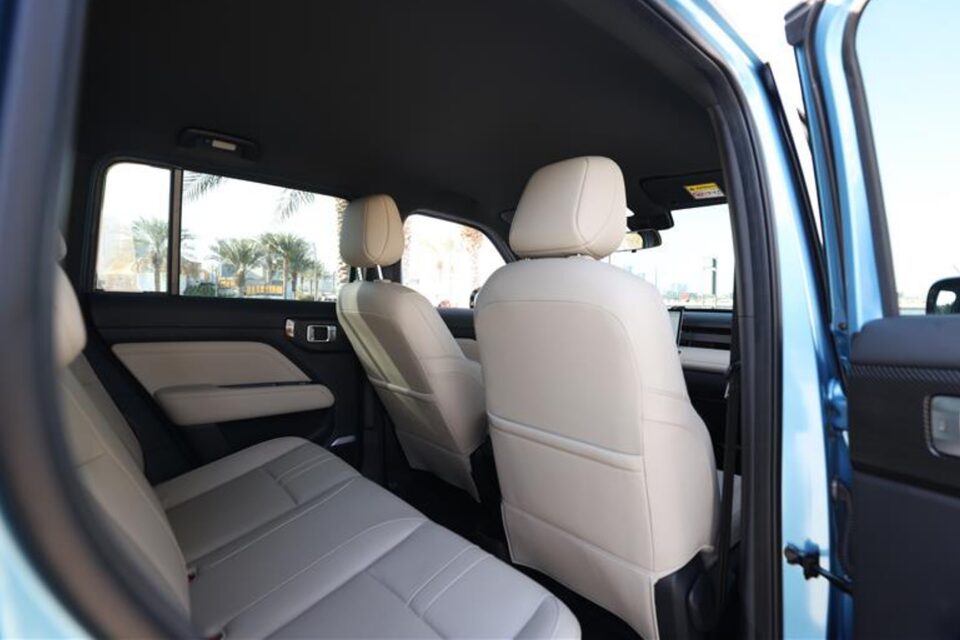 Rear interior of the Chevrolet Spark EUV with beige leatherette.