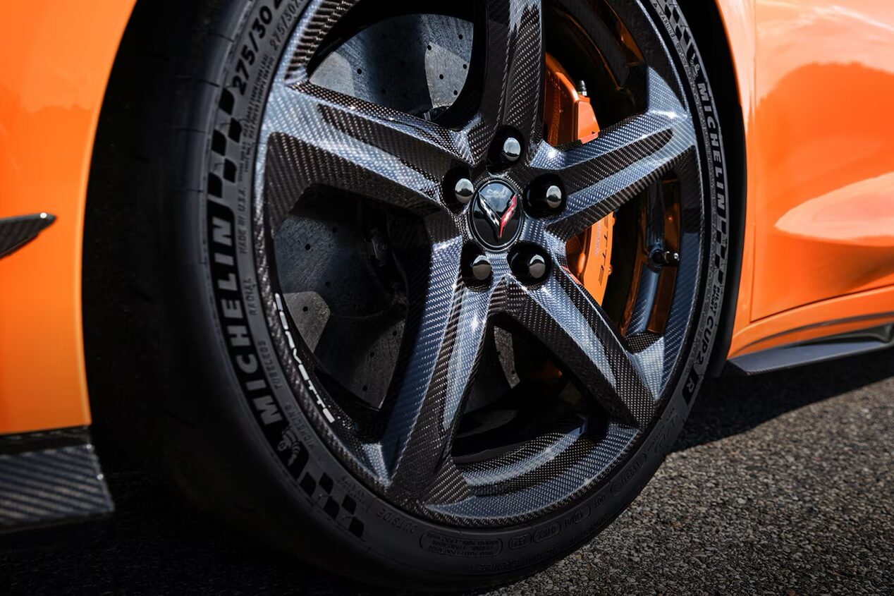 Close-up image of Orange Calipers & Black wheels
