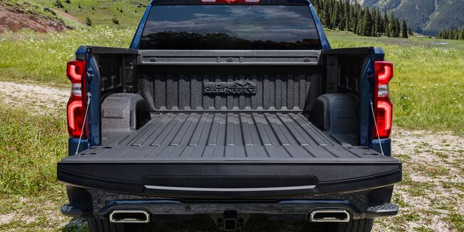 The Durabed of the Silverado High Country With a Forest Backdrop