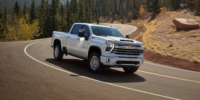 Northsky Blue Metallic Chevy Silverado HD Parked in the Snow