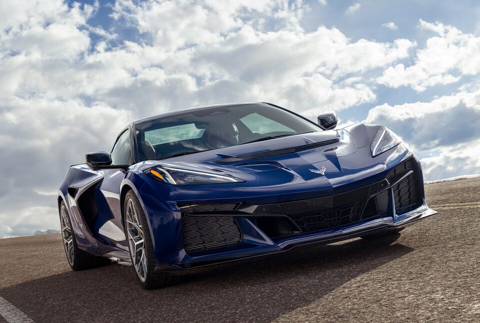 Low Angle Three Quarter View of a Blue Chevy Corvette ZR1 Going down the Road on a Sunny Day