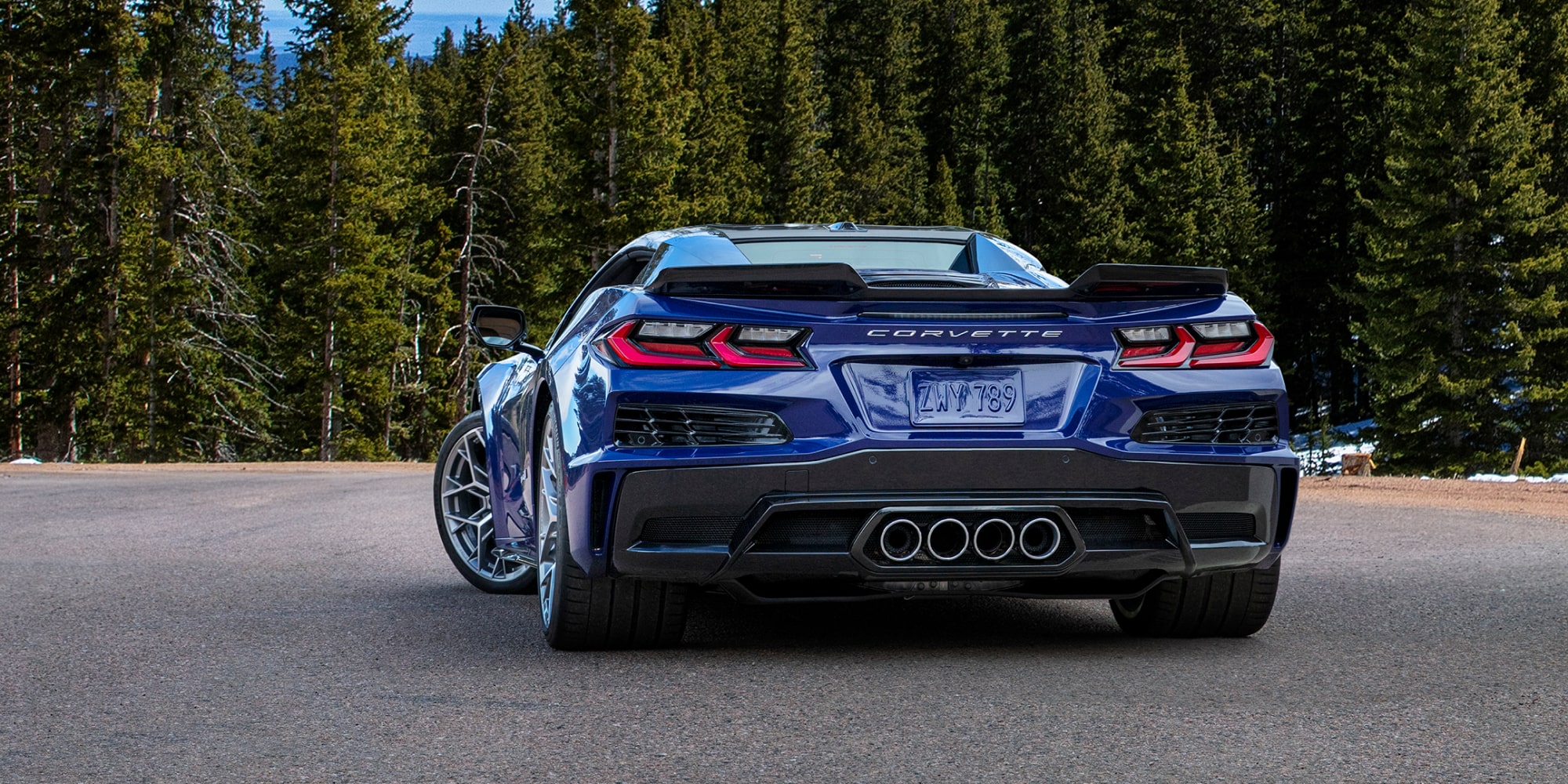 Rear View of a Purple 2026 Chevy Corvette ZR1 Surrounded by Trees
