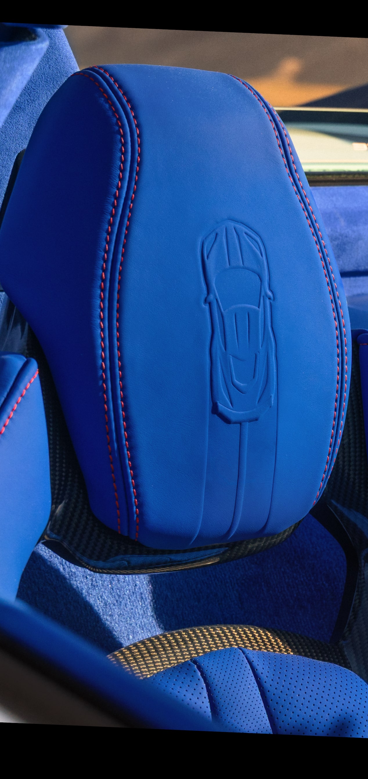Close-up of the 2027 Grand Sport's Blue Headrests with a Corvette Imprinted in the Material