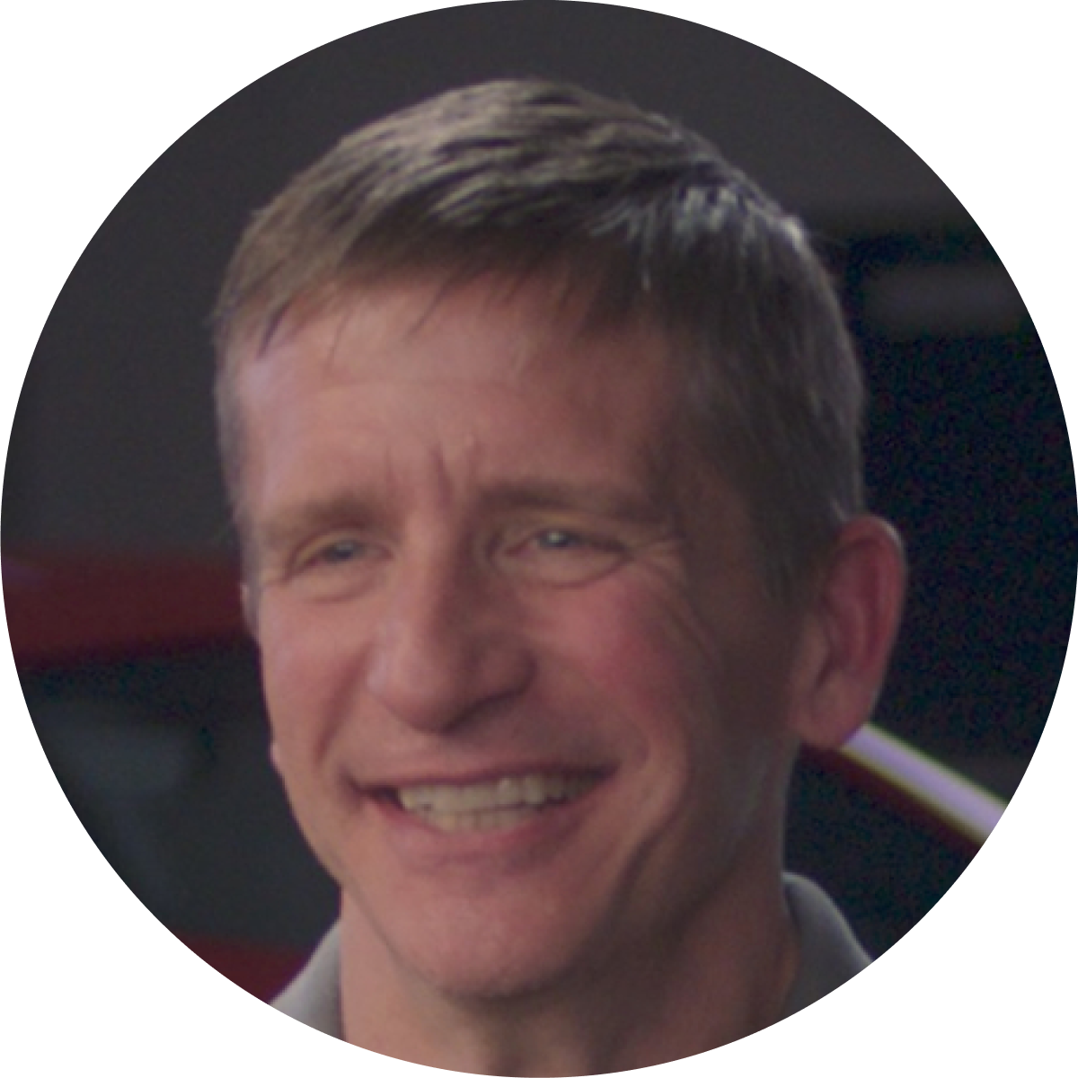 A Man With Short Light‑Colored Hair.