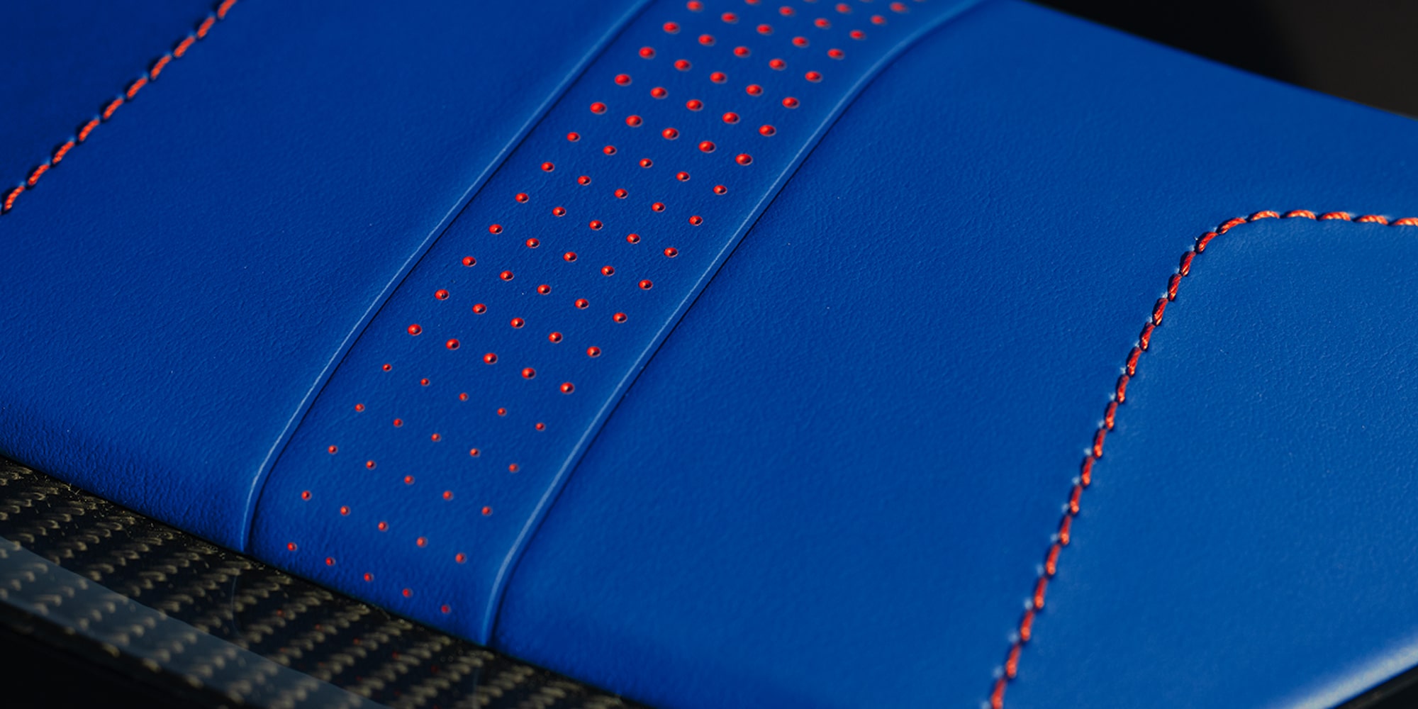 Close-up View of the Chevy Corvette Grand Sport Blue Interior Material with Red Stitching