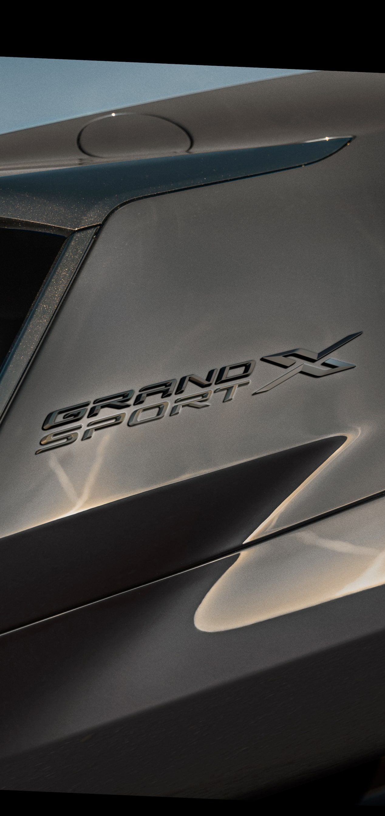 Close‑Up View of the Grand Sport X Rear Exterior Lights and Blue Accent Stripes