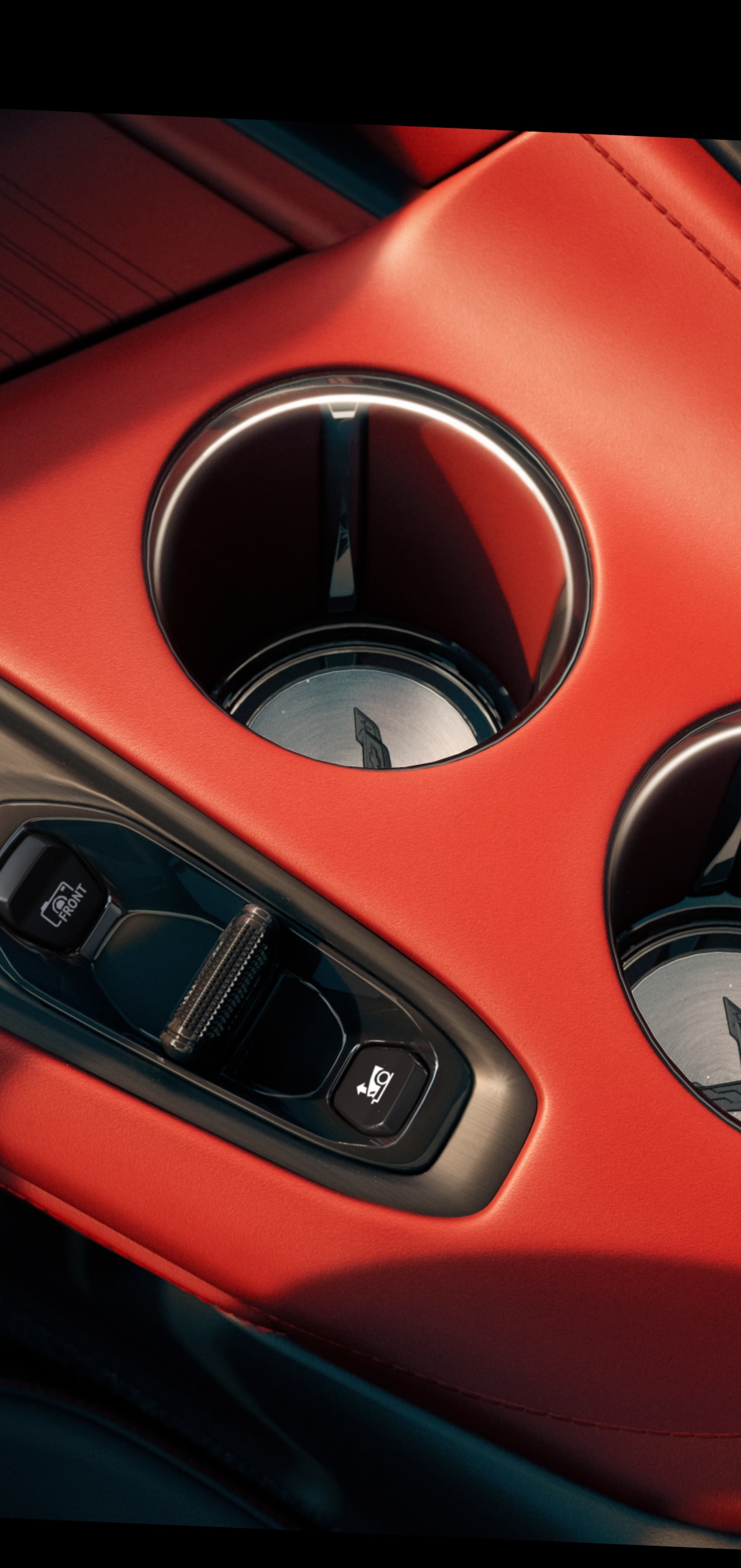 Primer plano de los portavasos y el interruptor del control de la consola central de Chevy Corvette 2027