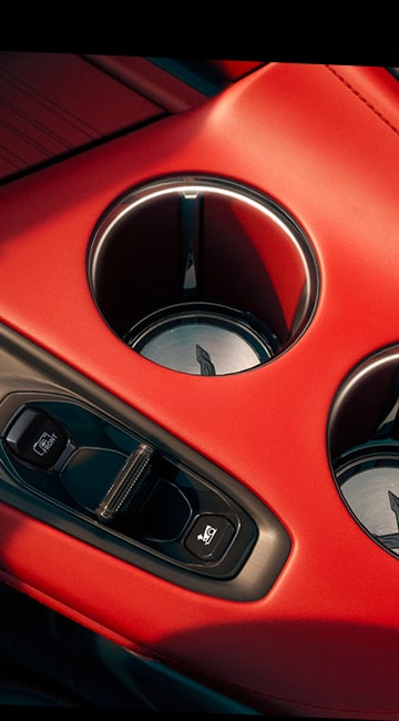 Close-Up of Rear Tail Light on the 2026 Chevy Corvette Stingray with a Woman in the Background