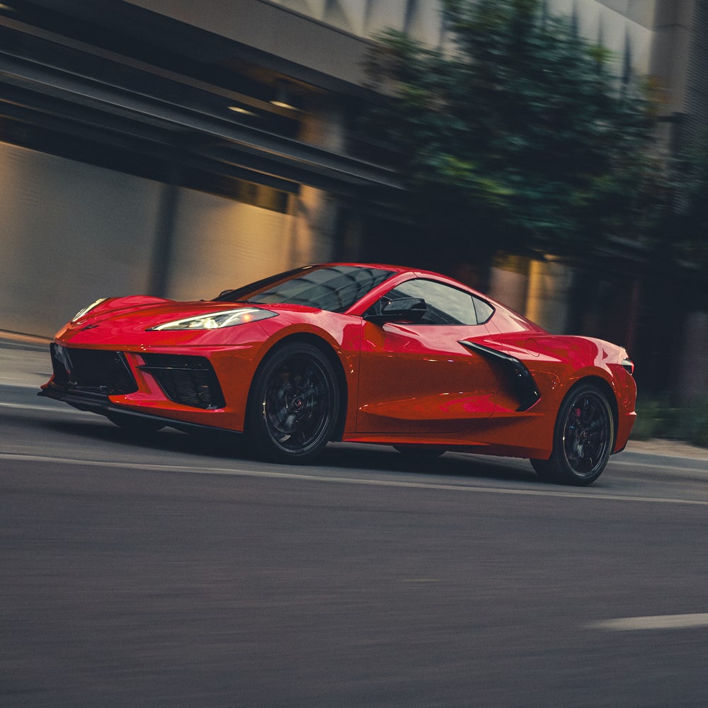 2027 Chevy Corvette Stingray Speeding Down a Road