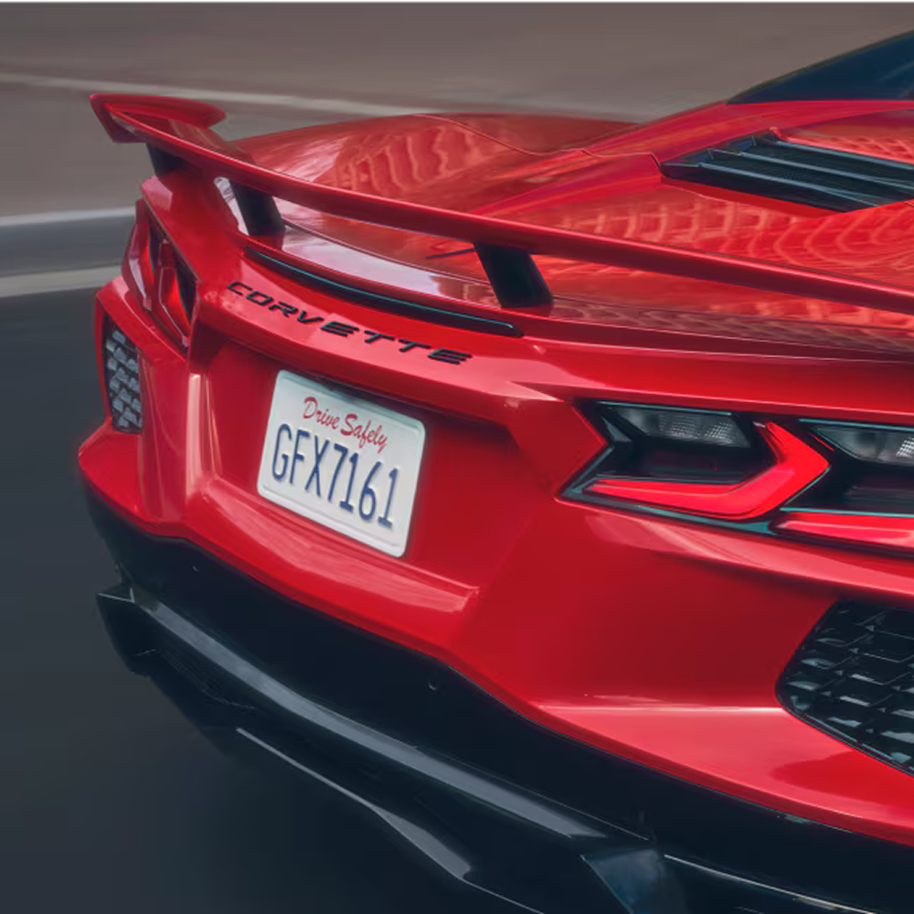 2027 Chevy Corvette Stingray Speeding Down a Road