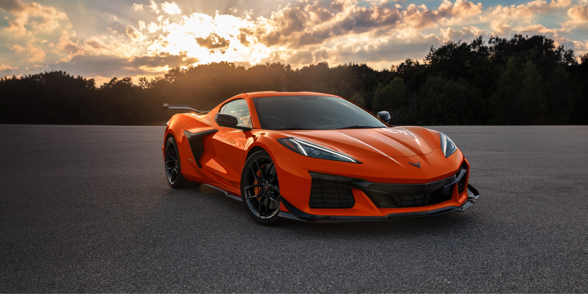 Three-quarter View of a 2027 Chevrolet Corvette Z06 Parked Outdoors During a Beautiful Sunset