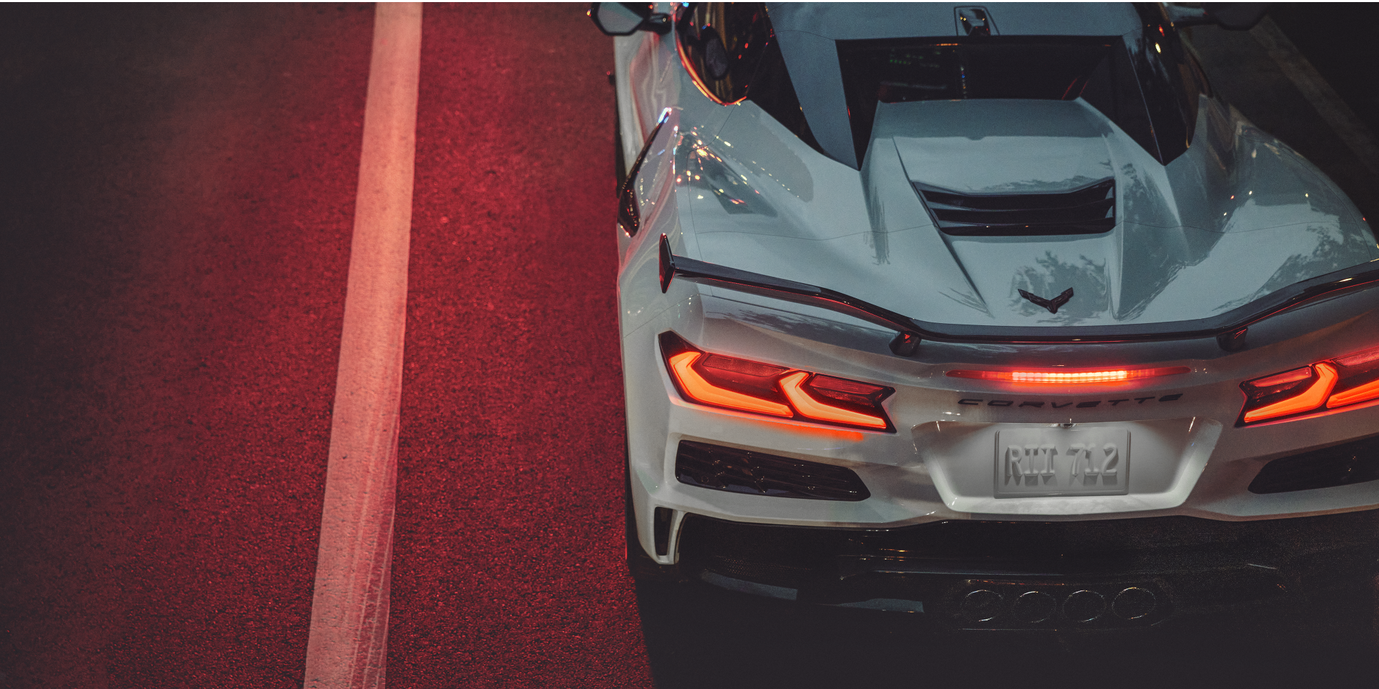 Top Rear View of the 2027 Chevrolet Corvette Z06 Driving Fast at Night