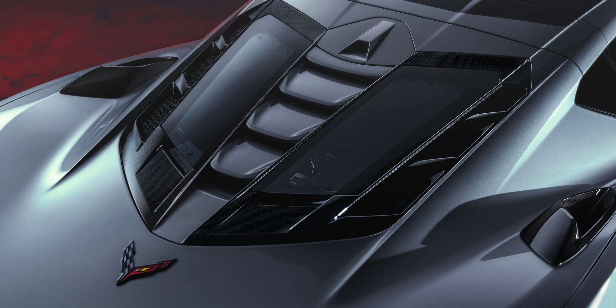 2027 Chevy Corvette ZR1X in Blade Silver Metallic Parked in a Warehouse