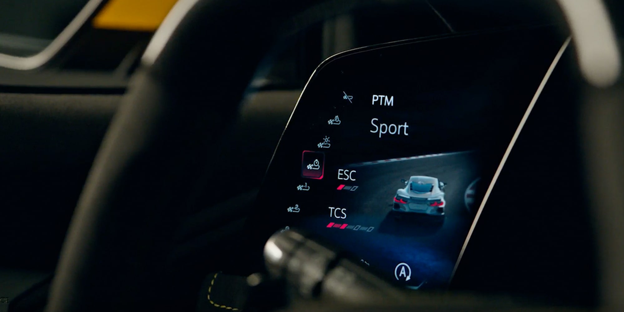 A Close-Up of the Center Touchscreen Inside the Chevy Corvette ZR1X Displaying Vehicle Settings with Climate and Drive Mode Controls on a Glossy Black Console.