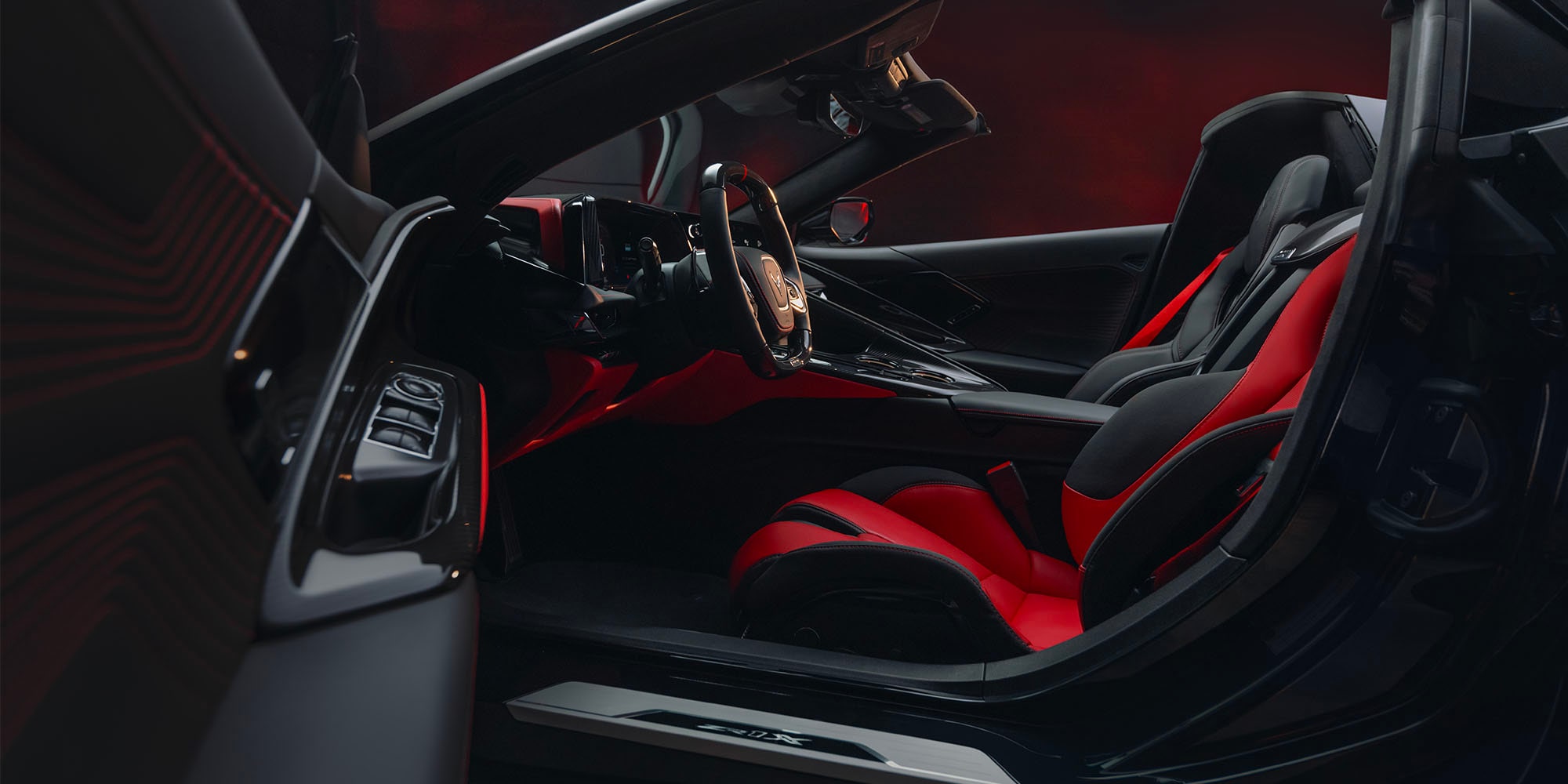 2027 Chevy Corvette ZR1X Seating with Asymmetrical Adrenaline Red / Jet Black Interior