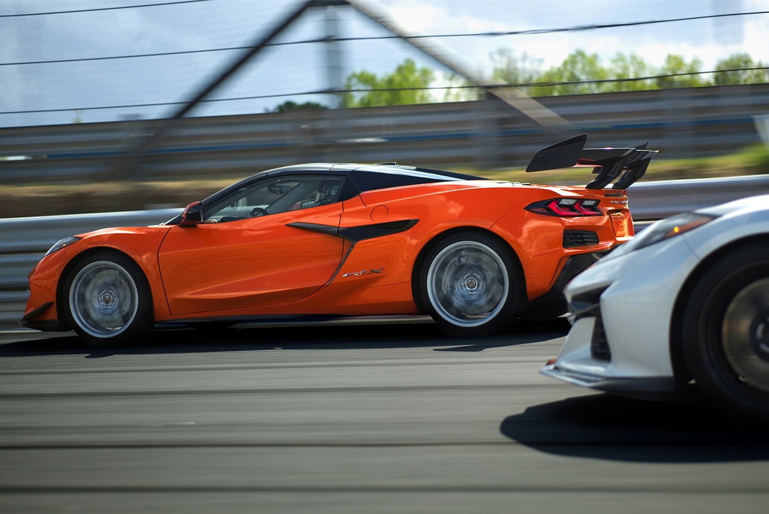 Two 2027 Chevy Corvette ZR1Xs Racing on a Track