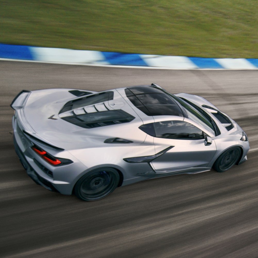 2027 Chevy Corvette ZR1X Racing Around a Bend on a Racetrack