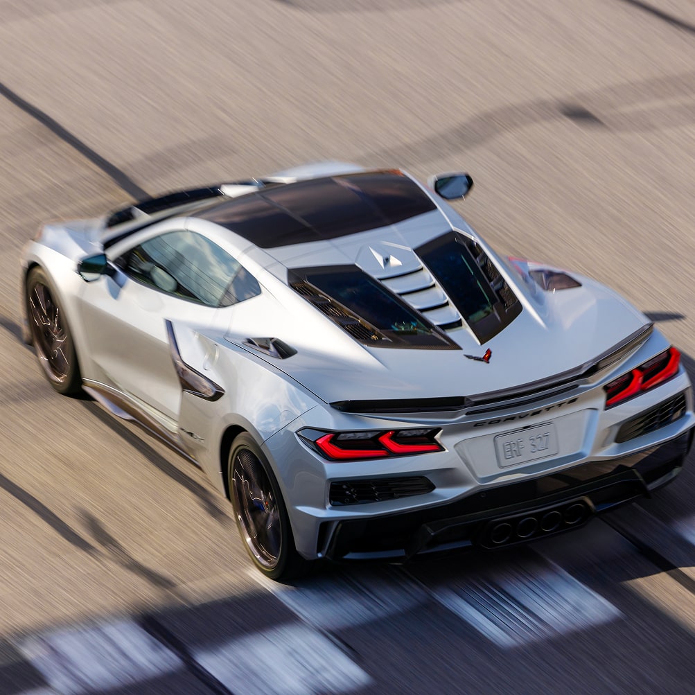 Bird's-eye View of a Gray Chevy Corvette ZR1X Speeding Past a Finish Line