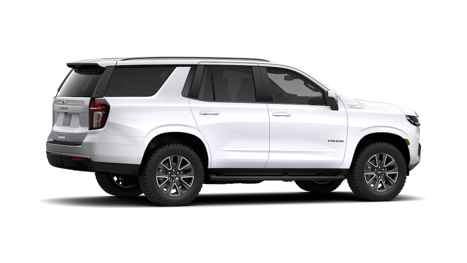 A white 2021 Chevy Tahoe from the side.
