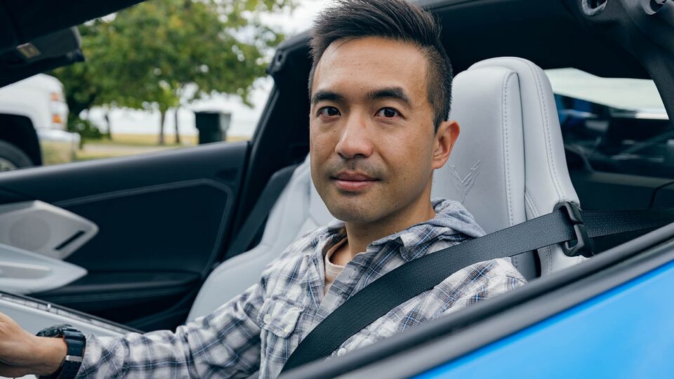 Ken Kuevibulvanich sits in the driver seat of his 2020 Corvette.