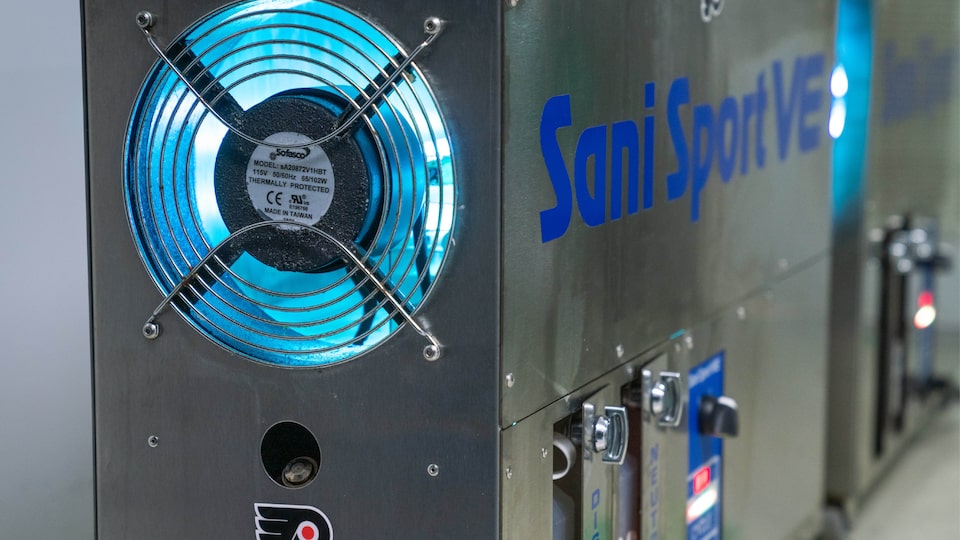 A close-up of a sanitation machine with the words “Sani Sport VE” on the side.