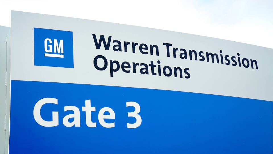 A building sign that reads “GM Warren Transmission Operations. Gate 3.”