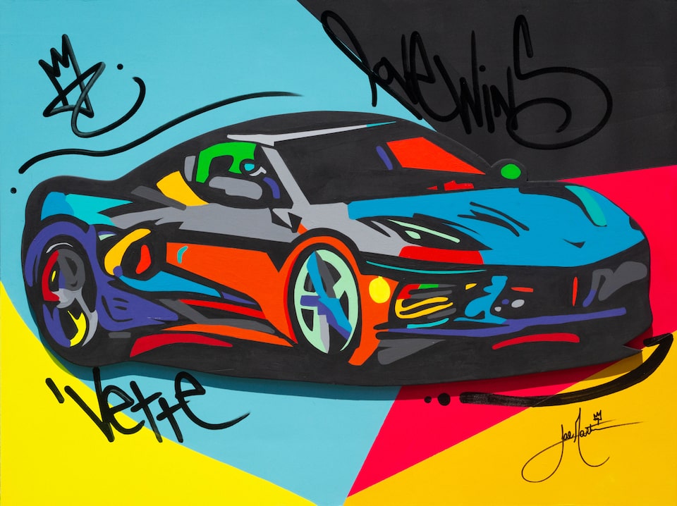 A Corvette illustration in shades of red, black, blue and yellow with the word “Vette” in a corner handwritten in black.