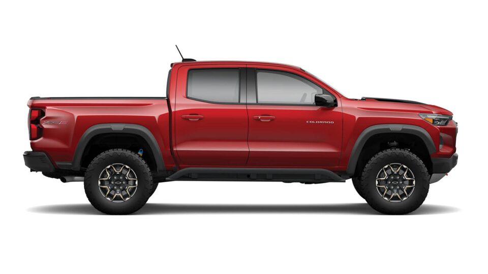 A red Colorado ZR2 seen from the passenger side.