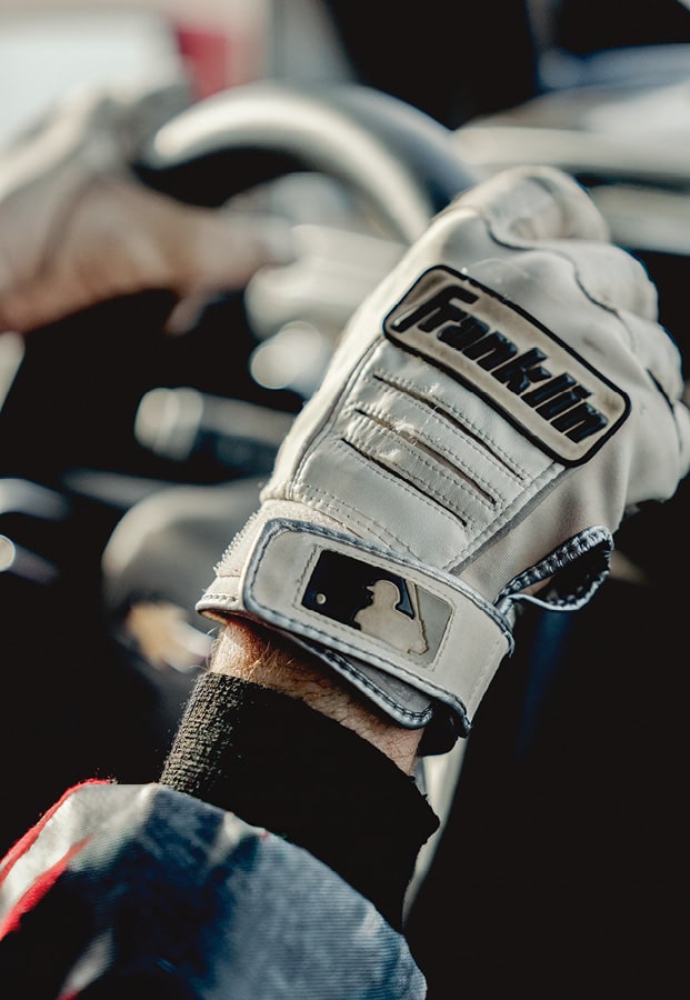 A closeup of Chad Hall's gloved hand on the steering wheel of his Colorado ZR2.