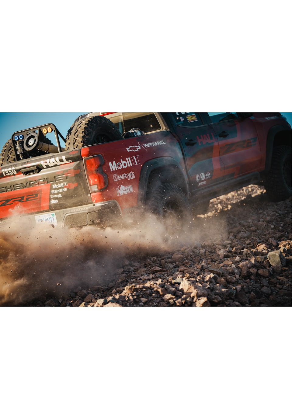 The rear of Chad Hall's Colorado ZR2 as it skids through dust and rocks.
