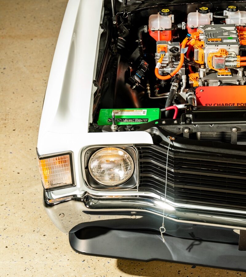 A closeup of the electrical components under the hood of a 1972 El Camino converted to electric.