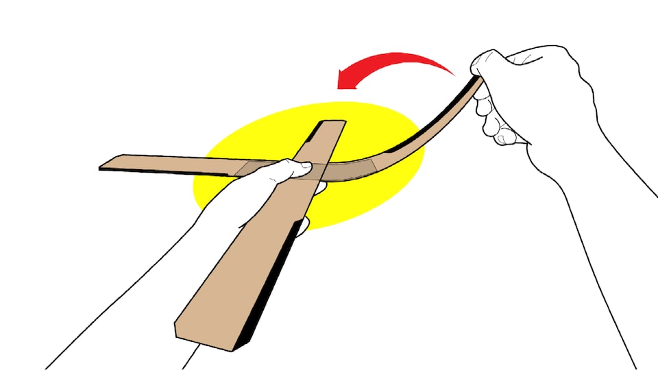 An illustration of someone’s hands bending up one blade of a four-blade cardboard boomerang.