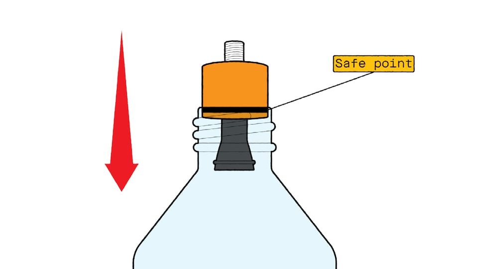 A closeup illustration of a cork with a tire stem stuck through it inserted to a line marked “safe point” on the cork. A red arrow next to the bottle points down.