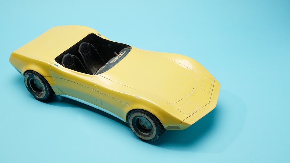 A yellow Hot Wheels Corvette Stingray prototype model.
