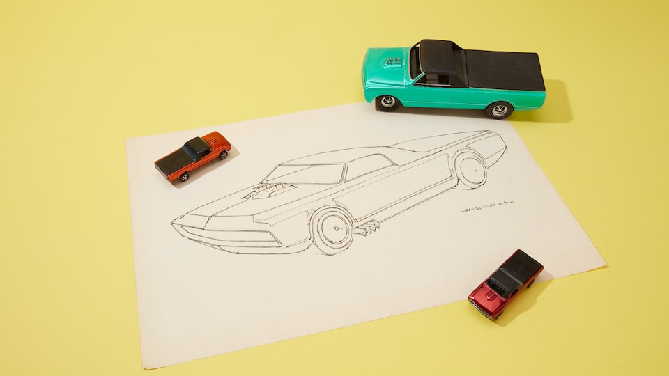 A prototype of an early Hot Wheels with its original line drawing.