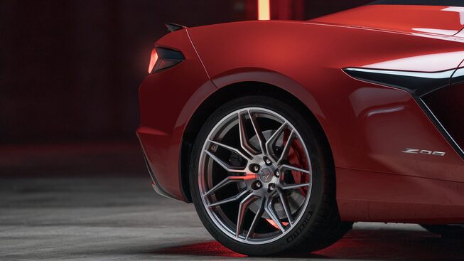 A red Corvette Z07 cropped in on the right rear quarter and wheel.