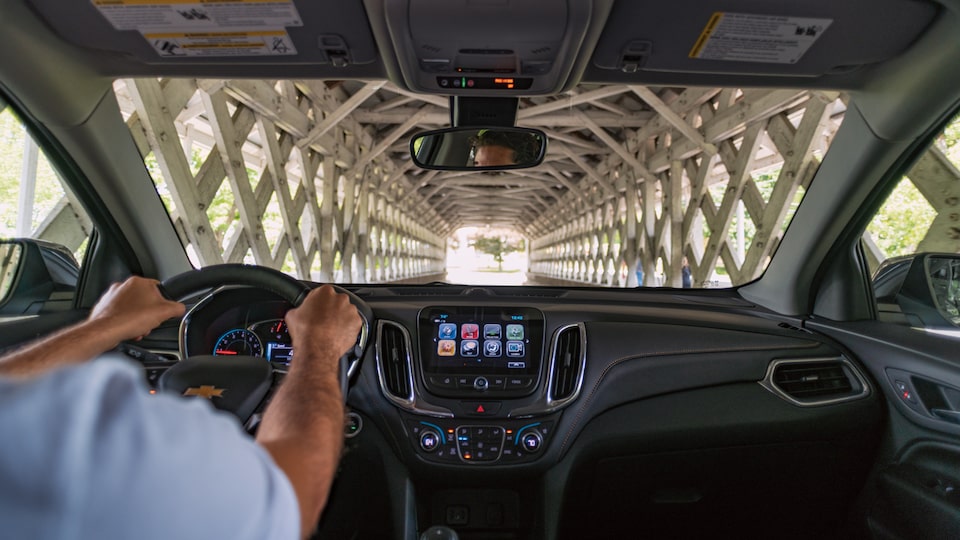 A covered bridge, seen through the windshield of an Equinox.