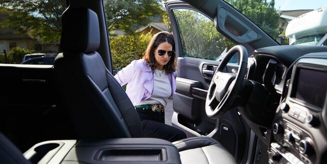 Beth Morgan climbing into the driver’s seat of the Silverado LTZ.