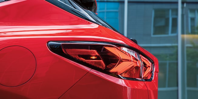 The side of the driver’s side taillight of a red Blazer RS.