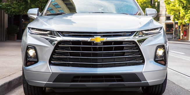The front end of a silver Chevy Blazer Premier.