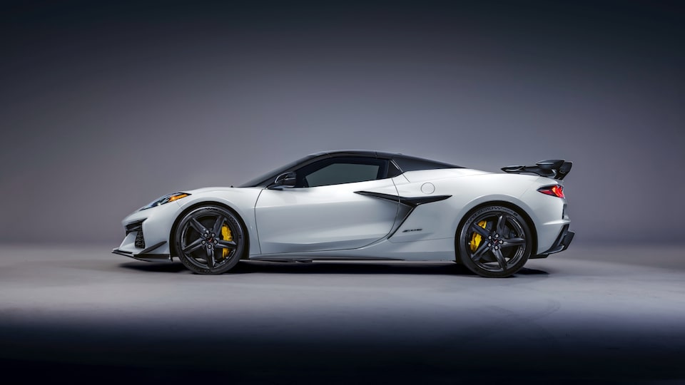 A driver’s side view of a white Corvette Z06 with black trim.