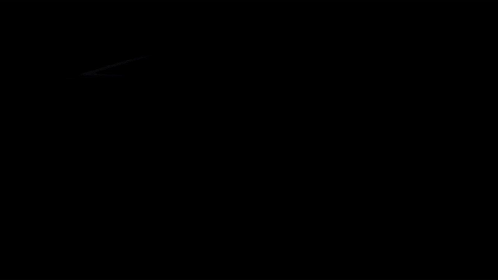 A gif of a side view of a black Camaro against a black background, with a light slowing illuminating it from above, from back to front.